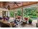 Spacious covered patio overlooks a refreshing pool and garden at 1426 Nottingham St, Orlando, FL 32803
