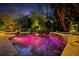 Backyard pool area featuring a hot tub, beautiful landscape, and patio seating at 1426 Nottingham St, Orlando, FL 32803