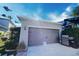 Attached garage with additional outdoor grilling station at 14493 Windsor Hall Way, Winter Garden, FL 34787