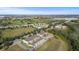 Aerial view of townhouses nestled near a lake at 15322 Murcott Blossom Blvd, Winter Garden, FL 34787