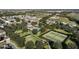 Aerial view of community with tennis courts, pool, playground, and homes at 15322 Murcott Blossom Blvd, Winter Garden, FL 34787