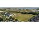 Aerial view of townhouses and open green space at 15322 Murcott Blossom Blvd, Winter Garden, FL 34787