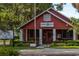 Red American Legion Post 63 building with white trim at 15322 Murcott Blossom Blvd, Winter Garden, FL 34787