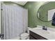 Modern bathroom with updated vanity and patterned shower curtain at 15322 Murcott Blossom Blvd, Winter Garden, FL 34787