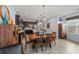 Bright dining area adjacent to the kitchen with a rustic wooden table at 15322 Murcott Blossom Blvd, Winter Garden, FL 34787