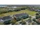 Beautiful townhomes overlooking a large green space and a lake create a picturesque and serene living environment at 15322 Murcott Blossom Blvd, Winter Garden, FL 34787