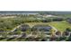 Aerial shot shows townhomes located near a serene lake and green space, offering a peaceful community atmosphere at 15322 Murcott Blossom Blvd, Winter Garden, FL 34787