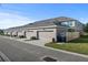Townhouse garages with ample parking and landscaping at 15322 Murcott Blossom Blvd, Winter Garden, FL 34787