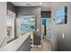 Upstairs hallway with gray walls and abstract art at 15322 Murcott Blossom Blvd, Winter Garden, FL 34787