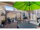 Outdoor patio featuring a pergola, table, and chairs at 15322 Murcott Blossom Blvd, Winter Garden, FL 34787