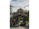 Ornate brick archway entrance to Winter Garden, featuring clock tower and landscaping at 15322 Murcott Blossom Blvd, Winter Garden, FL 34787