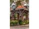 Close-up of Winter Garden's brick archway entrance, showcasing clock and landscaping at 15322 Murcott Blossom Blvd, Winter Garden, FL 34787