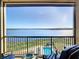 Stunning balcony view overlooking lake, pool, and landscape at 16300 County Road 455 # 610, Montverde, FL 34756