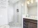 Modern bathroom with walk-in shower and double vanity at 16300 County Road 455 # 610, Montverde, FL 34756