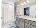 Clean bathroom with gray vanity and white tile at 16300 County Road 455 # 610, Montverde, FL 34756