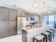 Modern kitchen with stainless steel appliances and island at 16300 County Road 455 # 610, Montverde, FL 34756