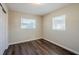 Bedroom with hardwood floors and double door closet at 1639 Hialeah St, Orlando, FL 32808