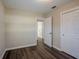 Bedroom with hardwood floors and access to other rooms at 1639 Hialeah St, Orlando, FL 32808