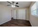 Bedroom with double door closet and ceiling fan at 1639 Hialeah St, Orlando, FL 32808