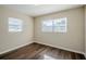 Well-lit bedroom with hardwood floors and window at 1639 Hialeah St, Orlando, FL 32808