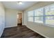 Laundry area with vinyl flooring, access to backyard, and ample space at 1639 Hialeah St, Orlando, FL 32808