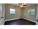 Bright bedroom with dark brown wood floors and neutral walls at 3017 Touraine Ave, Orlando, FL 32812