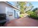 Brick patio with french doors and grill at 3032 Harbour Landing Way, Casselberry, FL 32707