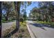 Residential street lined with lush trees and homes at 3032 Harbour Landing Way, Casselberry, FL 32707