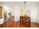 Casual dining area with wood table and chairs, hardwood floors, and natural light at 4424 New Broad St, Orlando, FL 32814