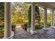 Covered porch with columns overlooking a tree-lined street at 4424 New Broad St, Orlando, FL 32814