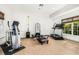 Home gym with a treadmill, elliptical, and Pilates reformer at 4424 New Broad St, Orlando, FL 32814