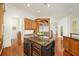 Island kitchen with granite countertops, stainless steel appliances, and wine cooler at 4424 New Broad St, Orlando, FL 32814
