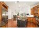 Large kitchen with granite island, stainless steel appliances, and hardwood floors at 4424 New Broad St, Orlando, FL 32814