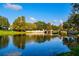 Scenic lake view with bridge and trees at 4424 New Broad St, Orlando, FL 32814