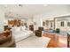 Open living room with a white couch and access to the outside patio at 4424 New Broad St, Orlando, FL 32814