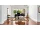 Elegant music room featuring a grand piano, guitar, and hardwood floors at 4424 New Broad St, Orlando, FL 32814