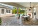 Spacious patio with fireplace, dining area, and pool views at 4424 New Broad St, Orlando, FL 32814