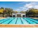 Community swimming pool with lounge chairs at 4424 New Broad St, Orlando, FL 32814