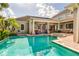 Inviting pool and spa surrounded by a spacious patio at 4424 New Broad St, Orlando, FL 32814