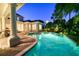 Expansive pool and spa area; night view at 4424 New Broad St, Orlando, FL 32814