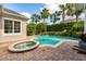 Relaxing pool and spa with lush landscaping and patio at 4424 New Broad St, Orlando, FL 32814