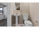 Updated bathroom with pedestal sink, toilet and tile floor at 542 N Firwood Dr, Deltona, FL 32725