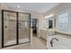 Spa-like bathroom featuring a soaking tub and shower at 663 Caterpillar Run, Winter Garden, FL 34787