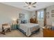 Cozy bedroom featuring a comfortable bed and plenty of natural light at 663 Caterpillar Run, Winter Garden, FL 34787