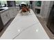 Close up of kitchen island with white quartz countertop at 820 Duff Dr, Winter Garden, FL 34787