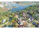 Aerial shot of the home with a red boundary, set against lush greenery and a beautiful lake backdrop at 1161 Roxboro Rd, Longwood, FL 32750