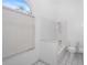Well-lit bathroom showcasing a tub, shower, toilet, and large window at 1161 Roxboro Rd, Longwood, FL 32750
