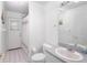 Well-lit bathroom featuring a large mirror, white fixtures, and tiled floors at 1161 Roxboro Rd, Longwood, FL 32750