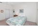 Cozy bedroom featuring a full-size bed, soft carpet, and ample closet space at 1161 Roxboro Rd, Longwood, FL 32750