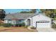 One-story house with gray siding, attached garage, and manicured landscaping at 1161 Roxboro Rd, Longwood, FL 32750